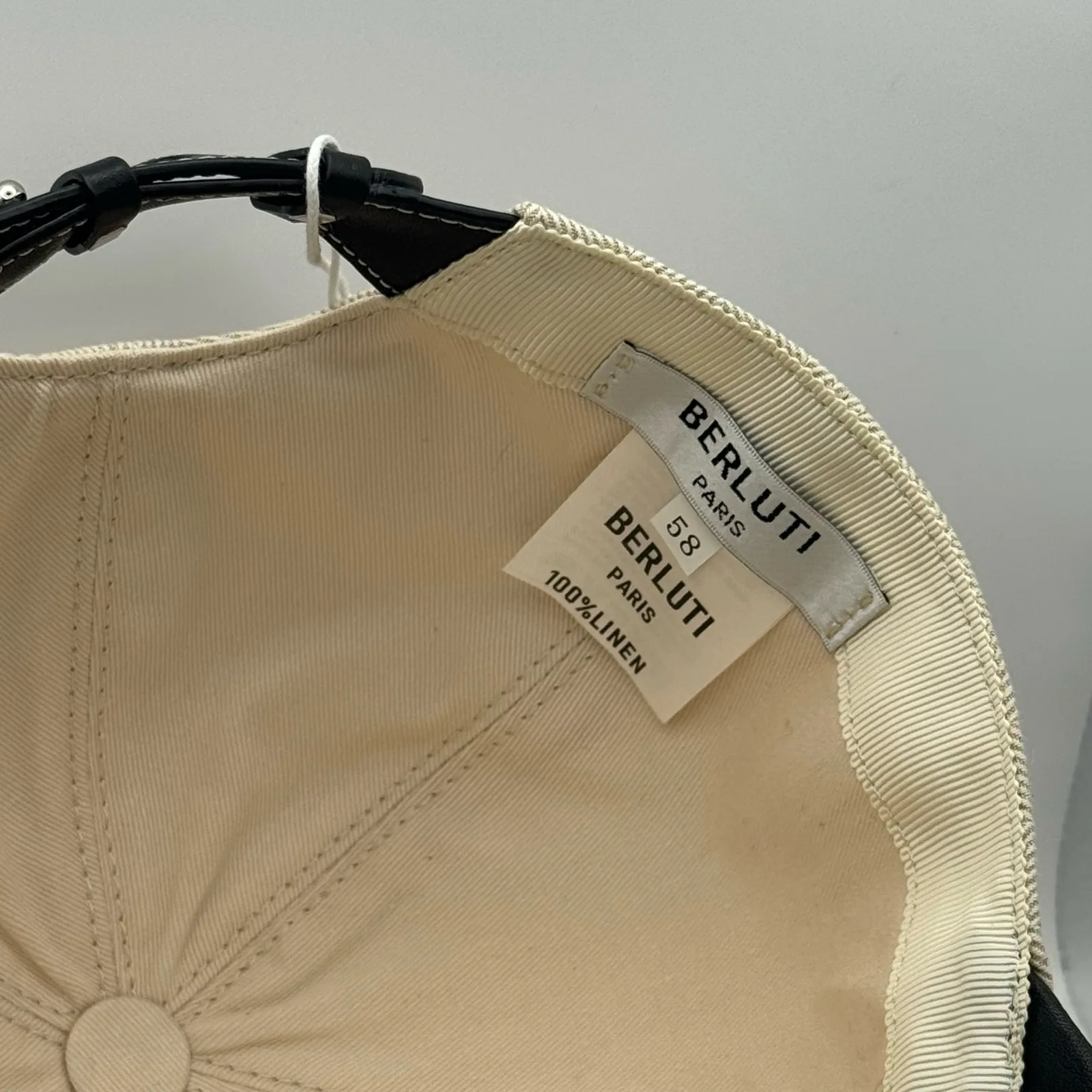 Close-up of the interior brand label and size tag stitched into the crown lining.