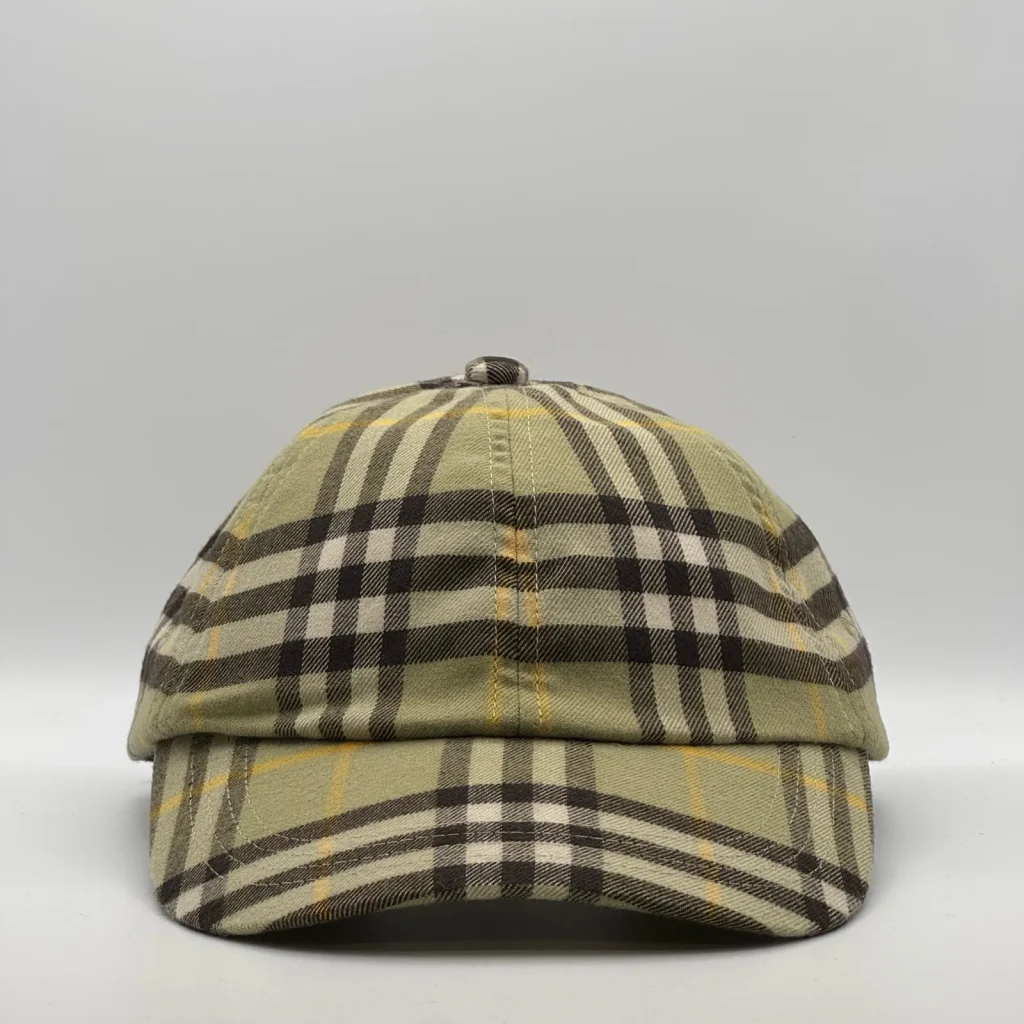Olive check Burberry cap, three-quarter front-left view.