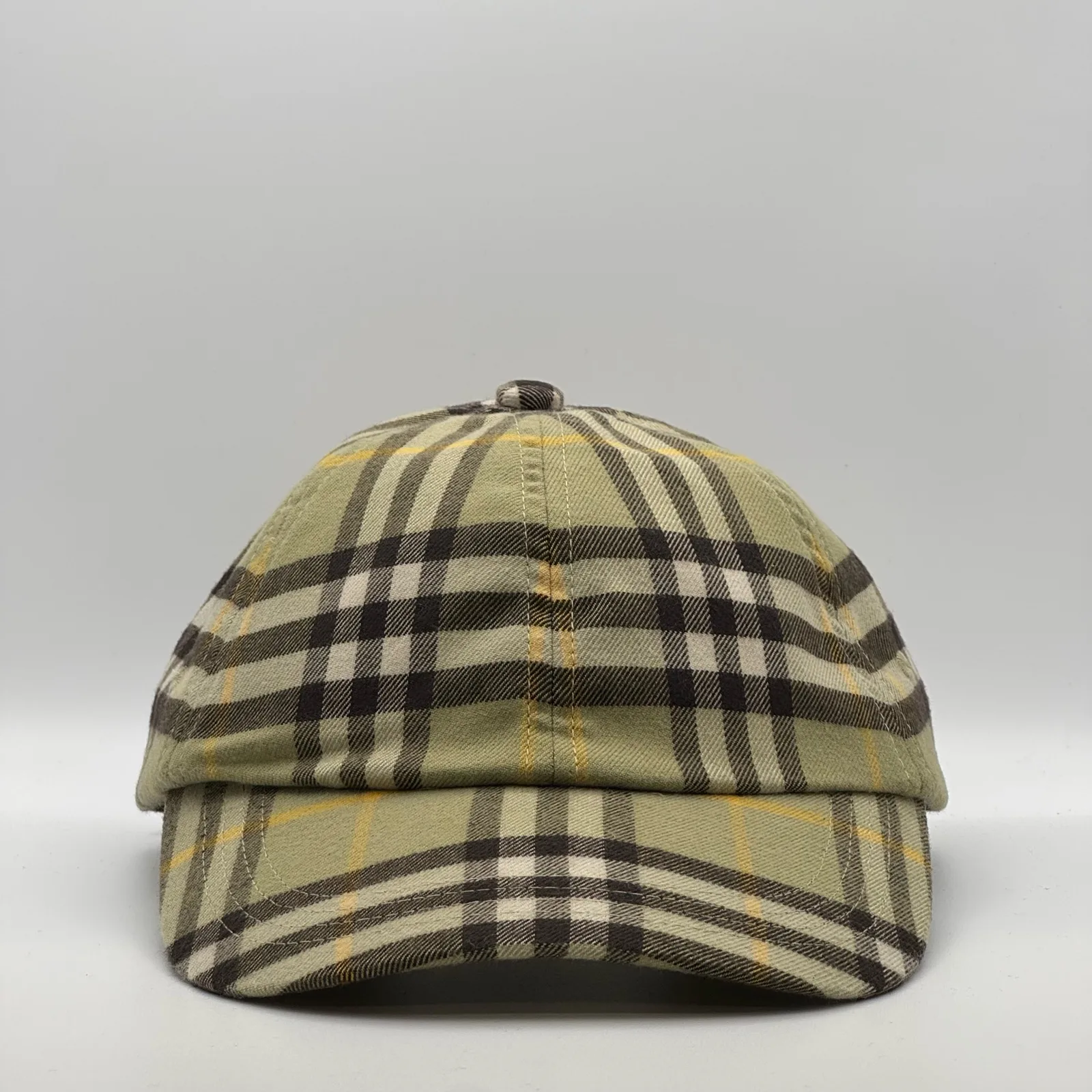 Olive check Burberry cap, three-quarter front-left view.