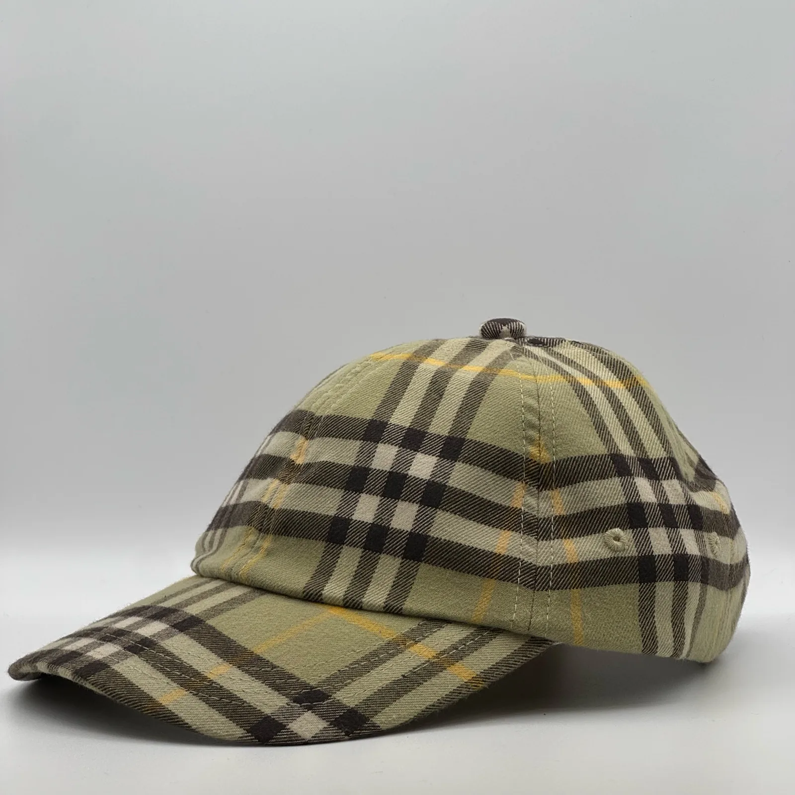 Olive check Burberry cap, three-quarter front-right view.