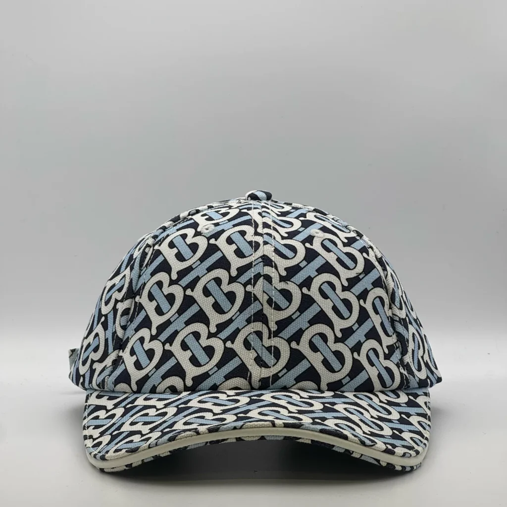 Navy Burberry TB Monogram cap, three-quarter front-left view.