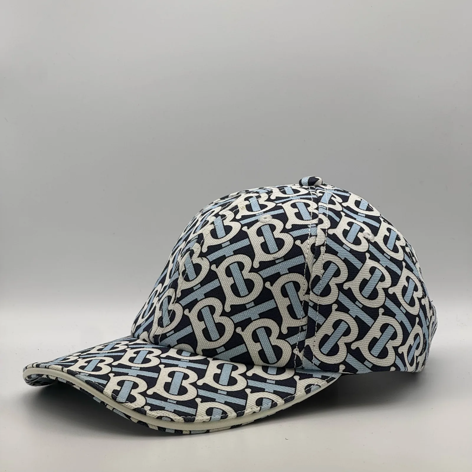 Navy Burberry TB Monogram cap, three-quarter front-right view.