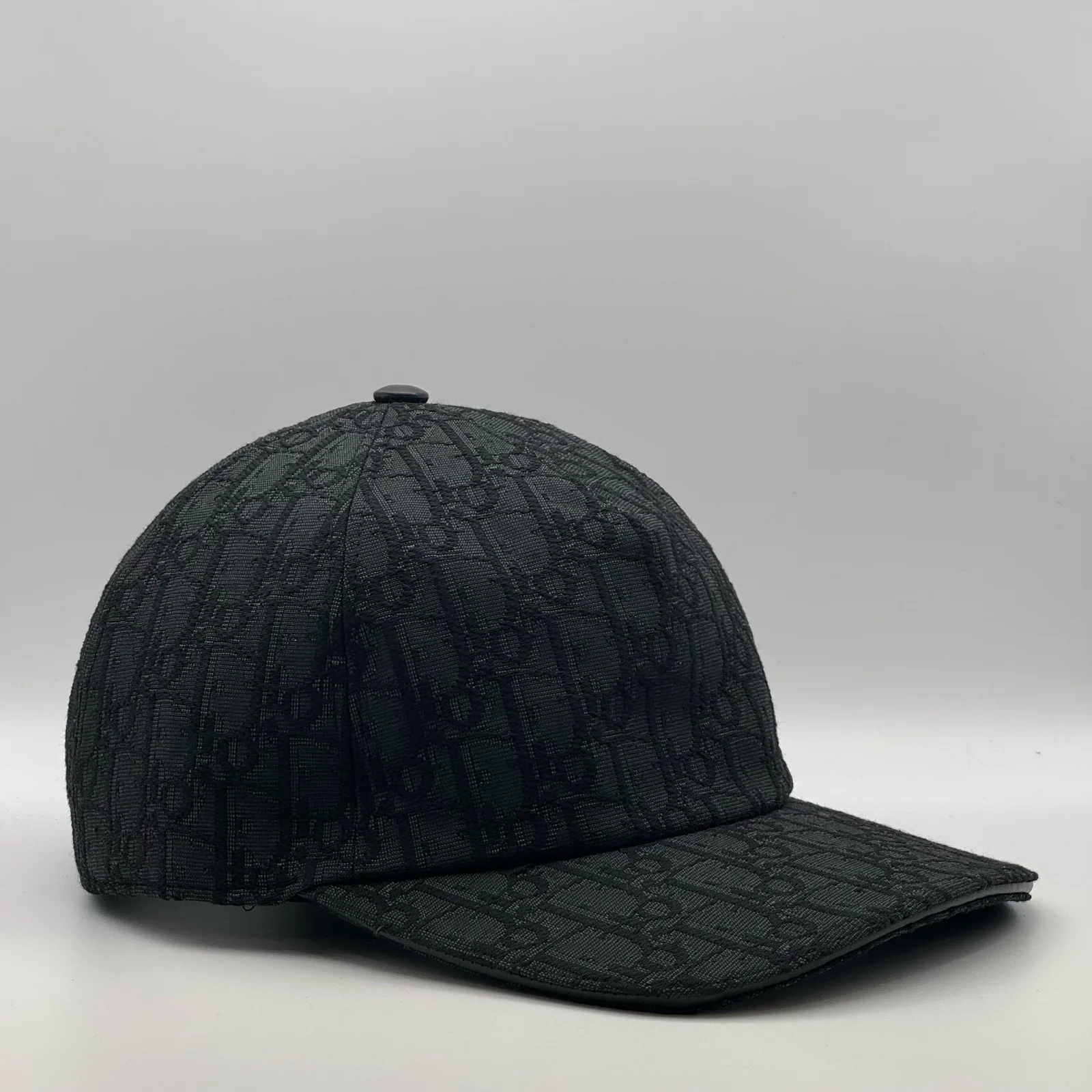 Black Dior Oblique cap, three-quarter side view.