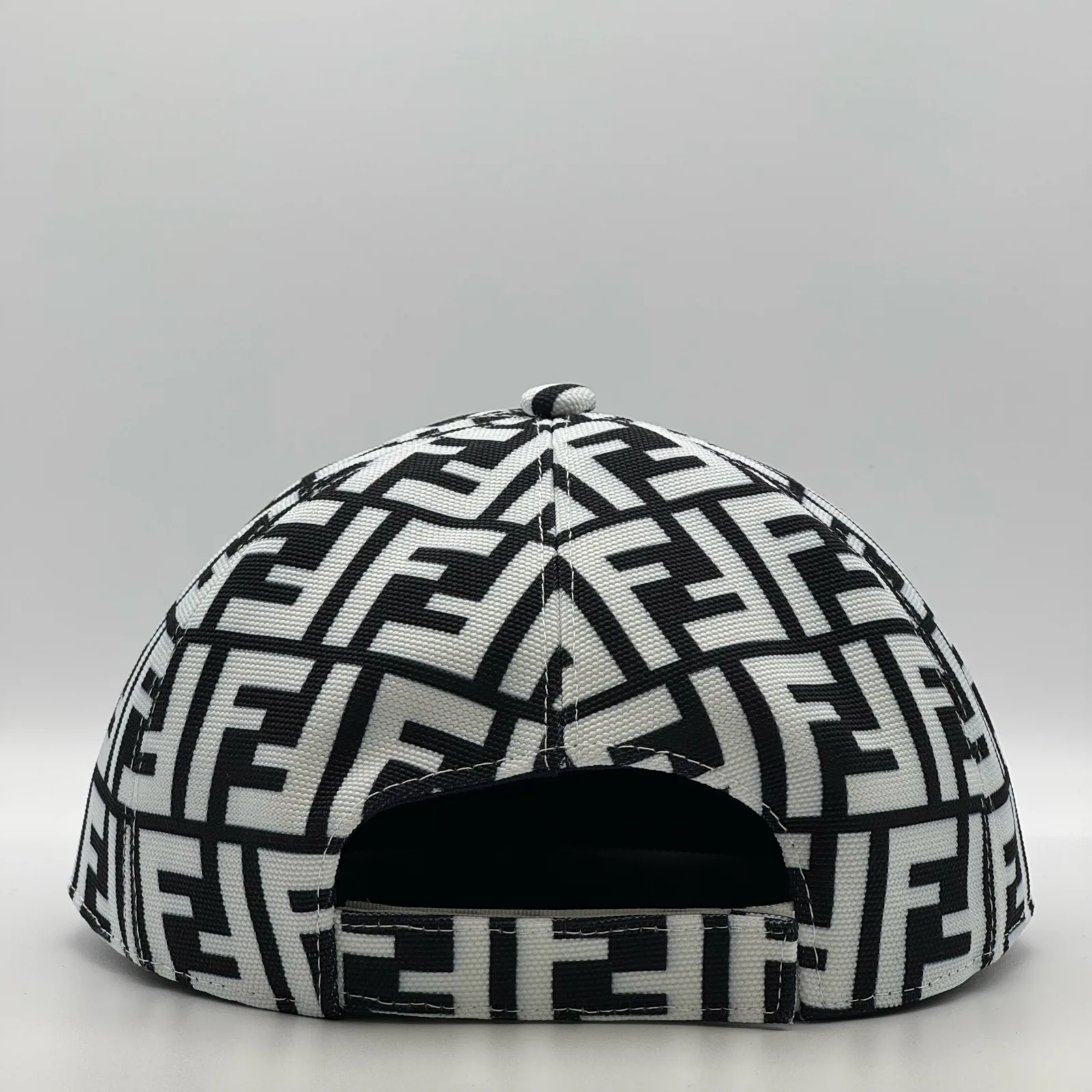 Black and white Fendi FF cap, back view showing the open adjuster.