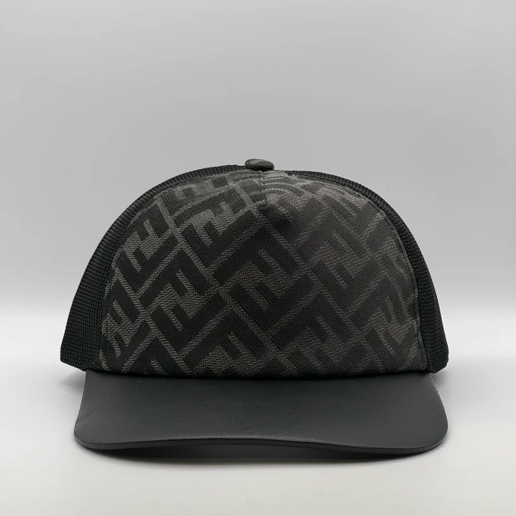 Black Fendi FF trucker cap, three-quarter front-left view.