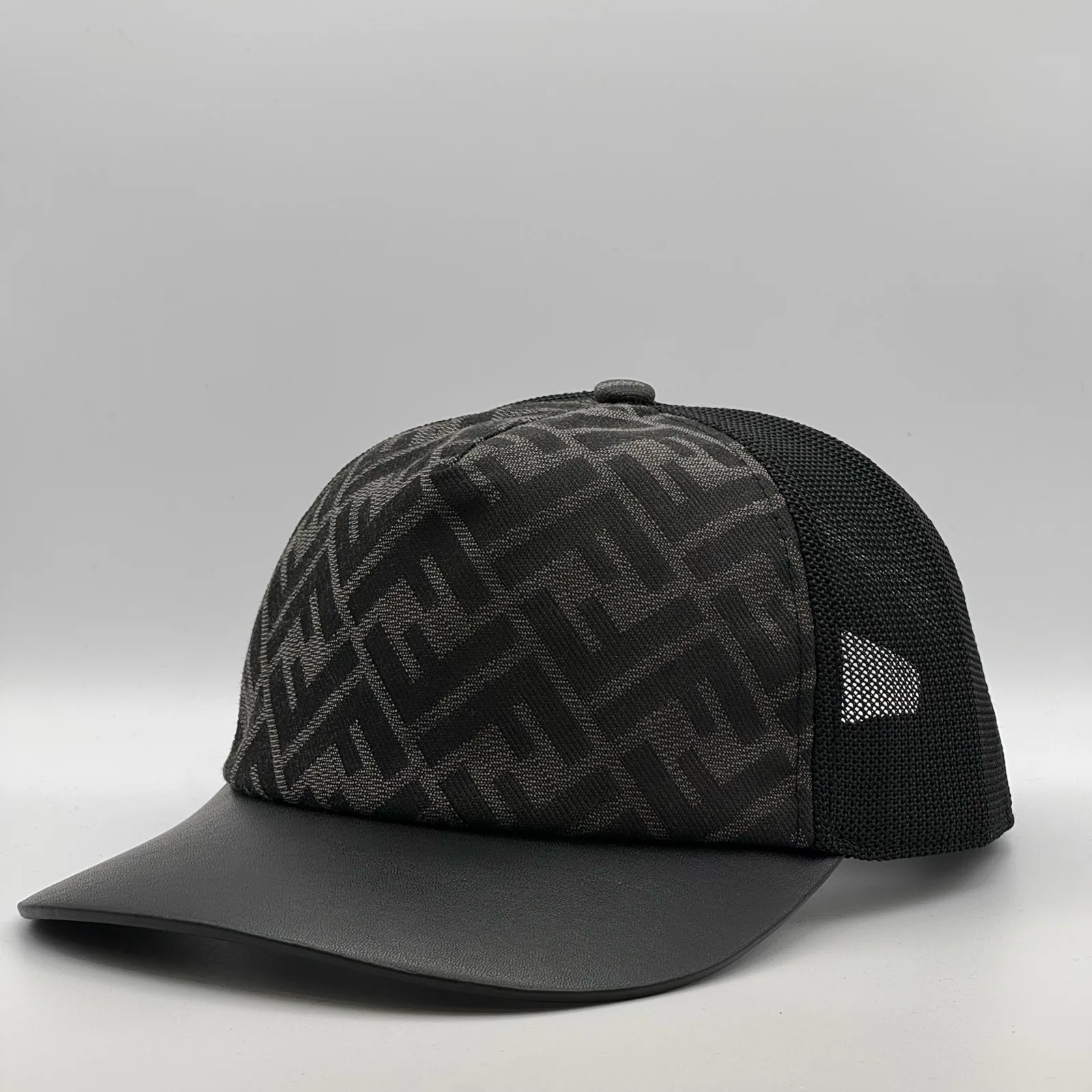 Black Fendi FF trucker cap, three-quarter front-right view.