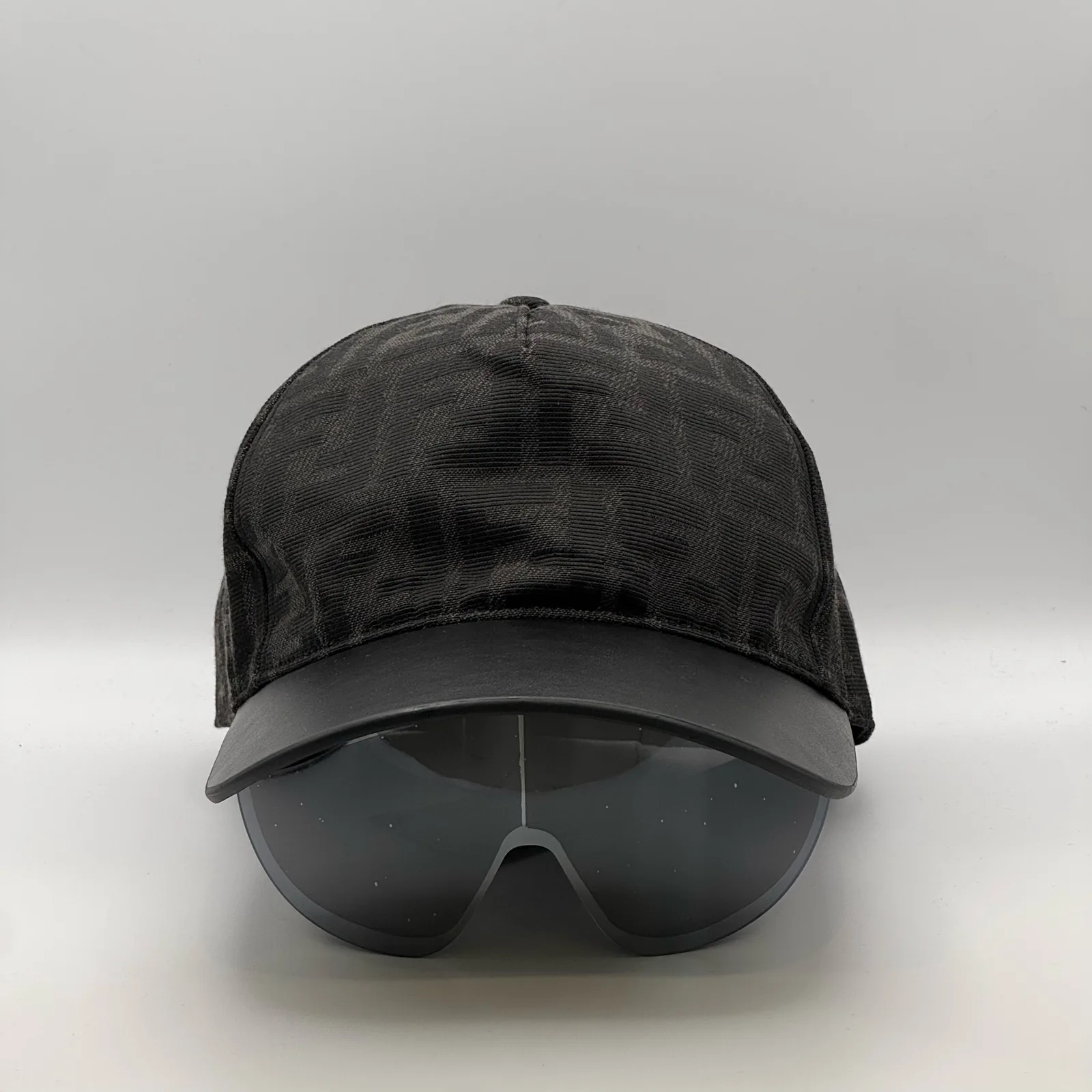 Black Fendi FF Visor cap, front view showing the tinted visor shield.