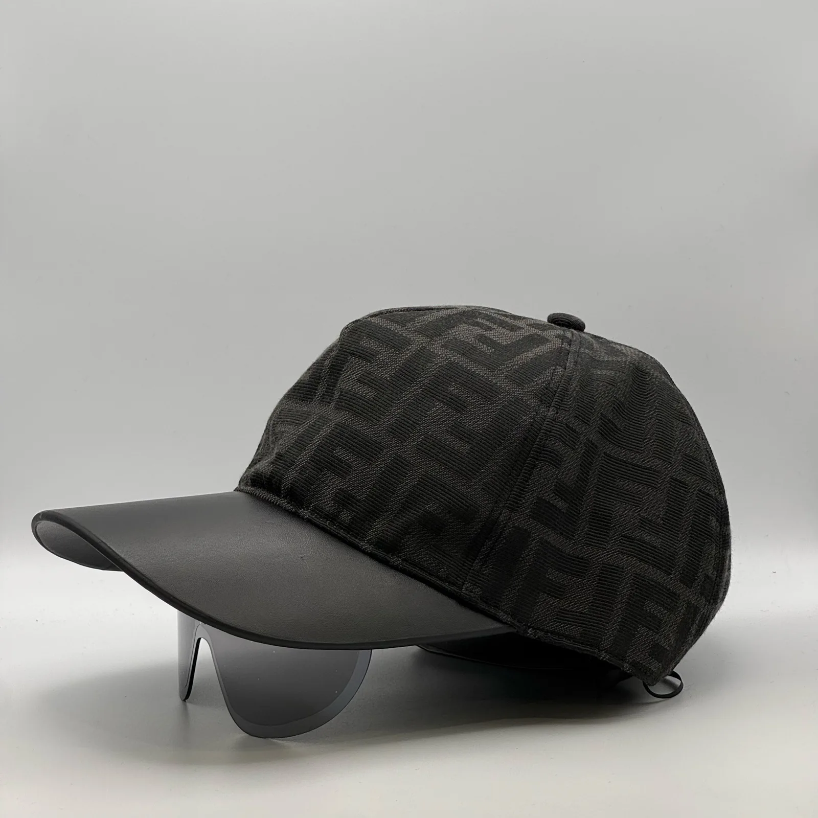 Black Fendi FF Visor cap, three-quarter angled view.