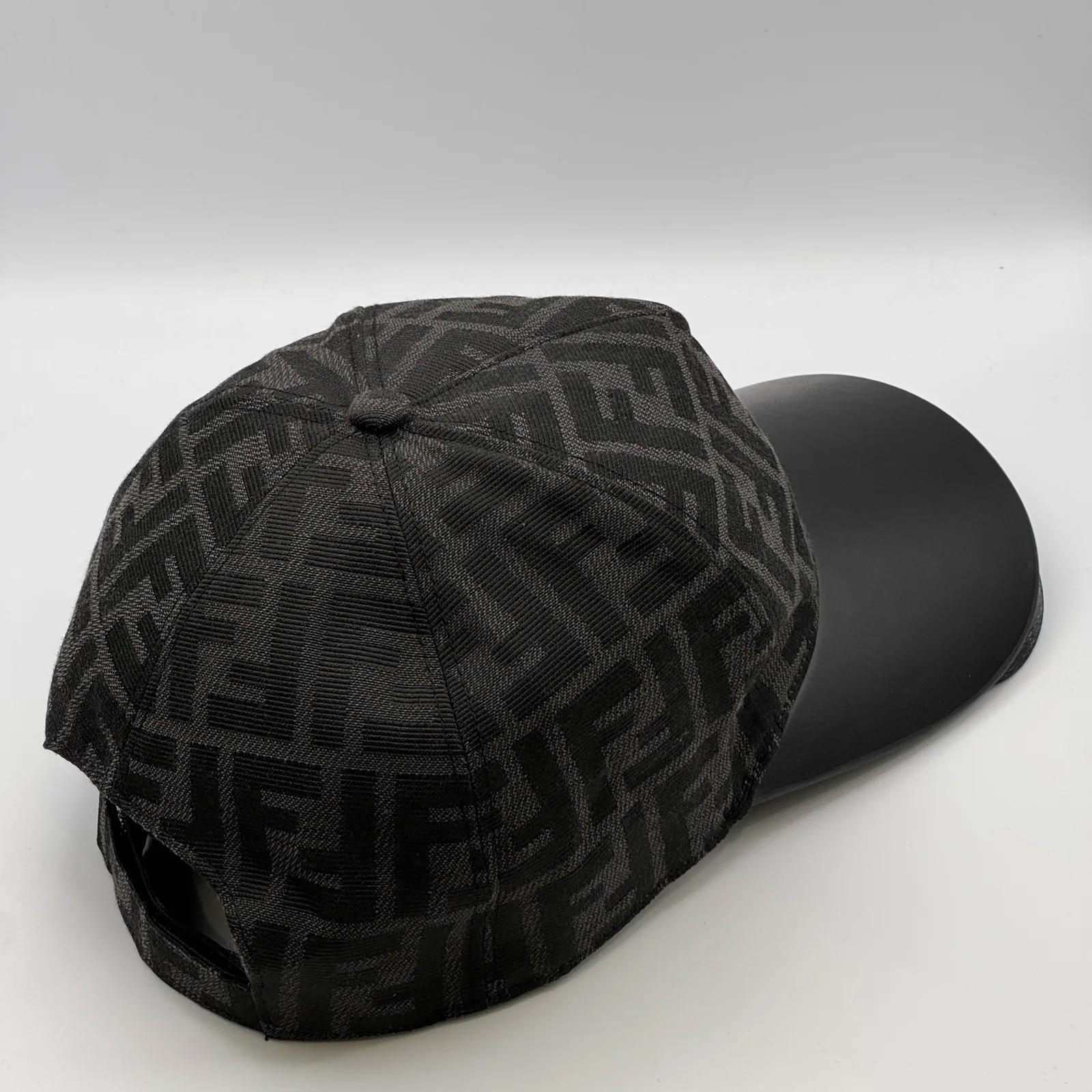 Black Fendi FF Visor cap, elevated three-quarter view of the crown and visor.