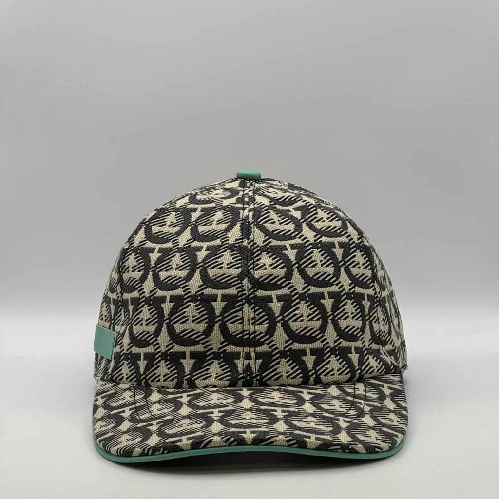 Ferragamo Gancini cap, front view in cream and charcoal weave with a mint green trim.