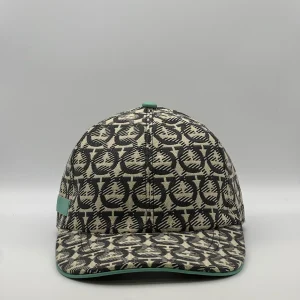Ferragamo Gancini cap, front view in cream and charcoal weave with a mint green trim.