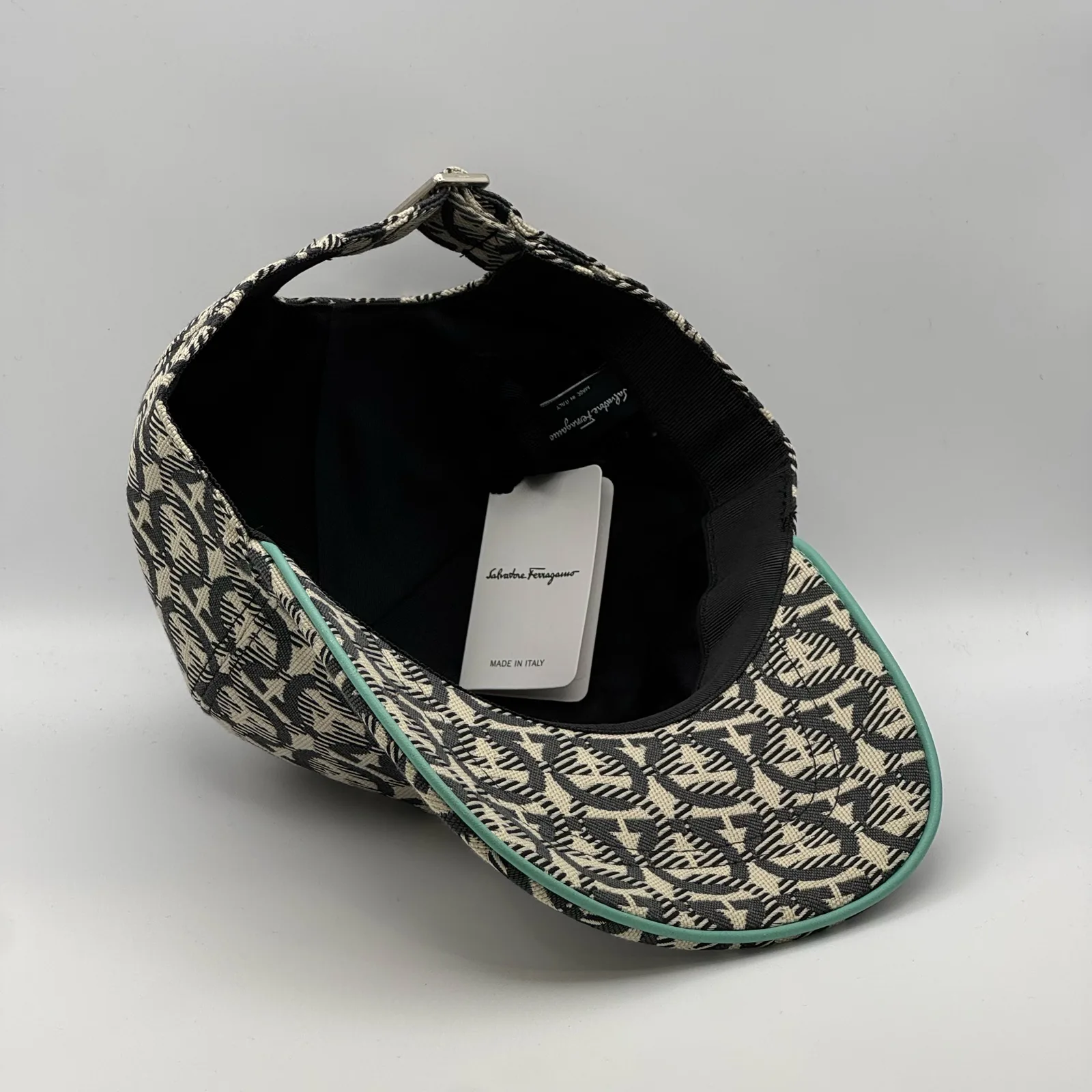 Ferragamo Gancini cap, underside view showing the black interior lining.