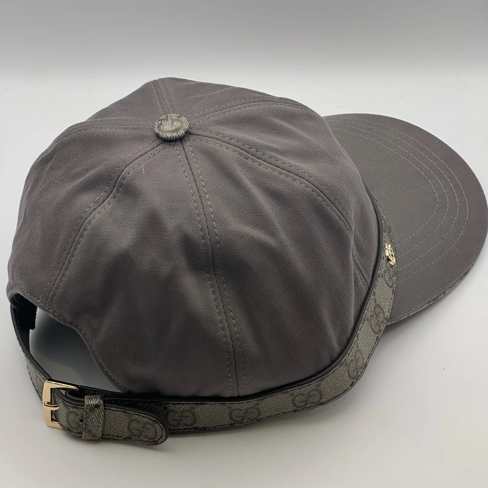 Grey GG band cap, back view with adjustable leather strap