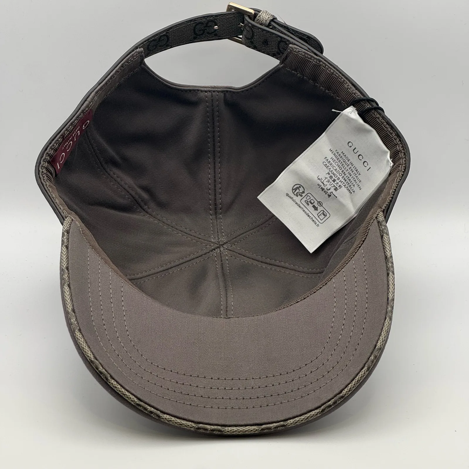 Grey GG band cap interior, brand tag and care label