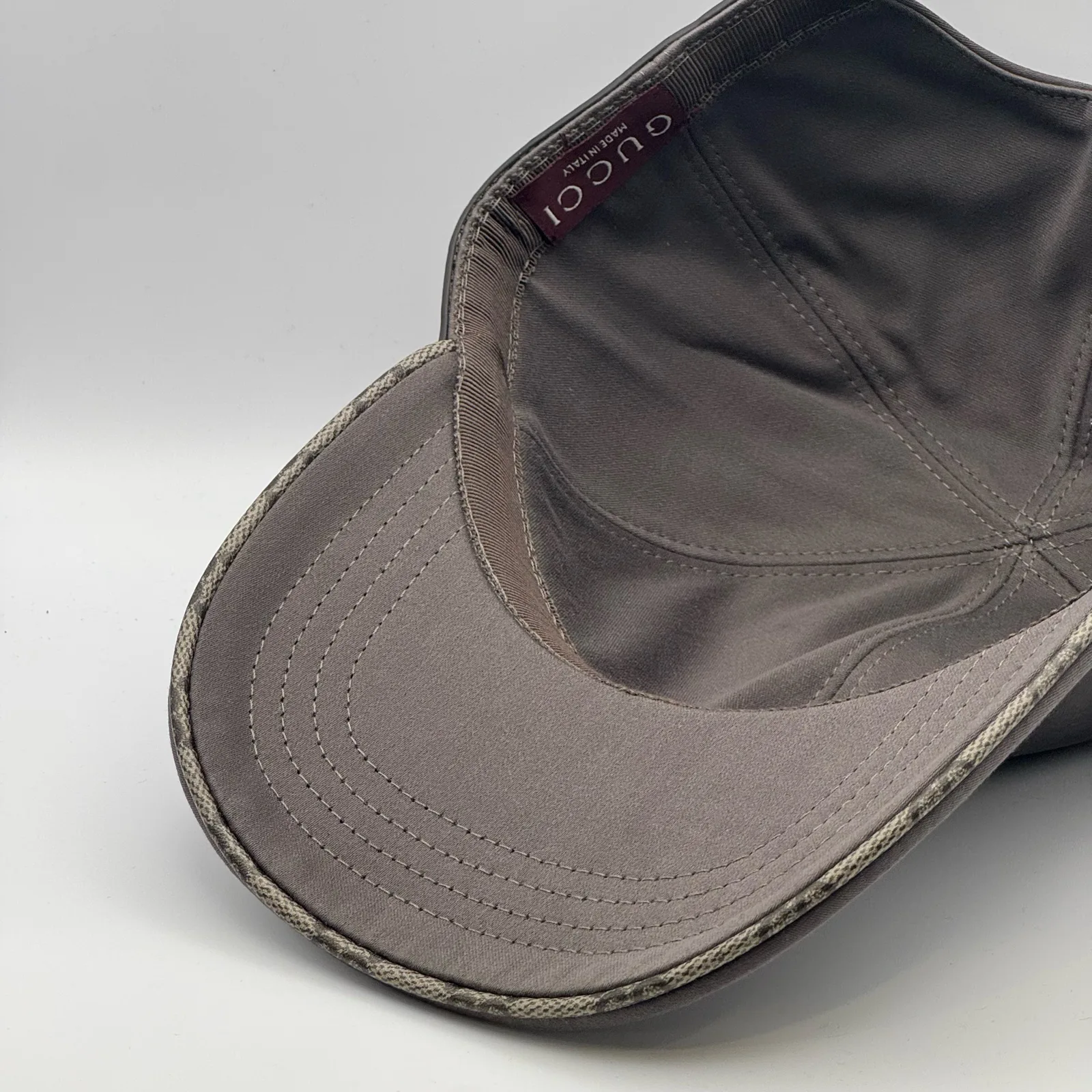 Grey GG band cap interior, close view of GG canvas underbrim