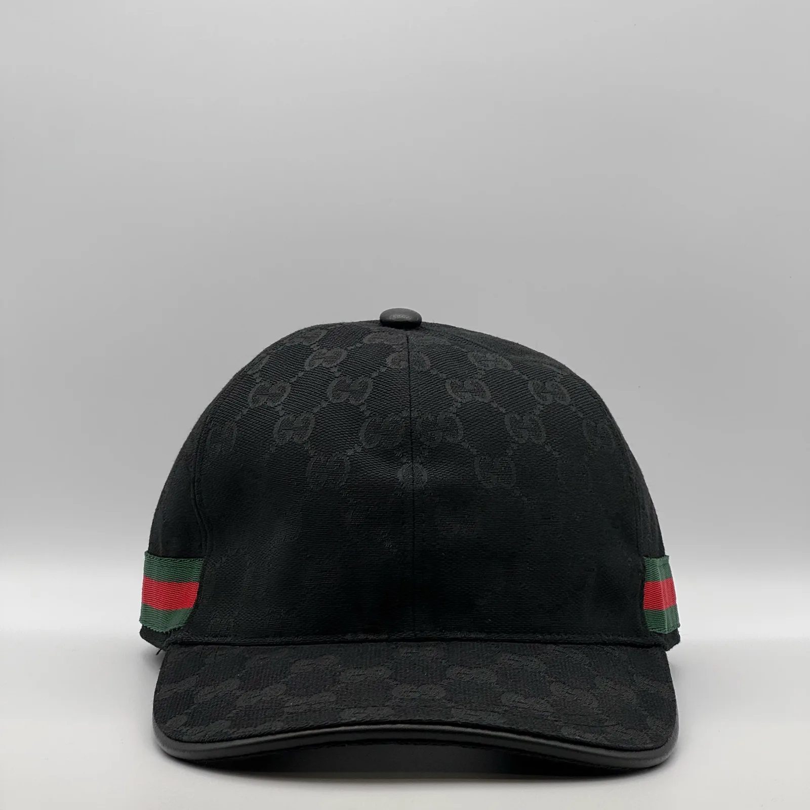 Black GG canvas cap, straight-on front view showing the tonal GG jacquard pattern