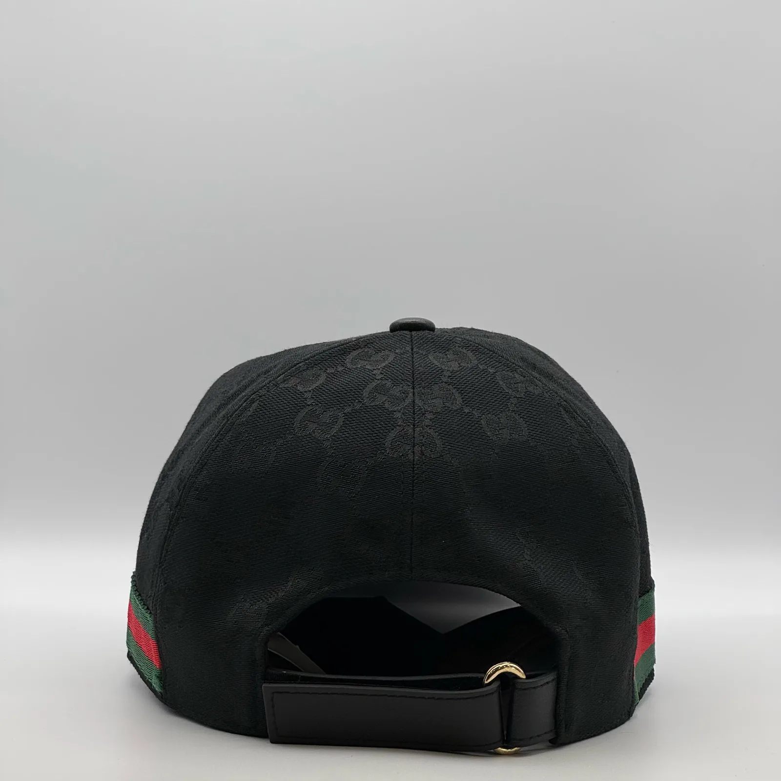 Black GG canvas cap, back view with adjustable strap and web stripe wrapping around
