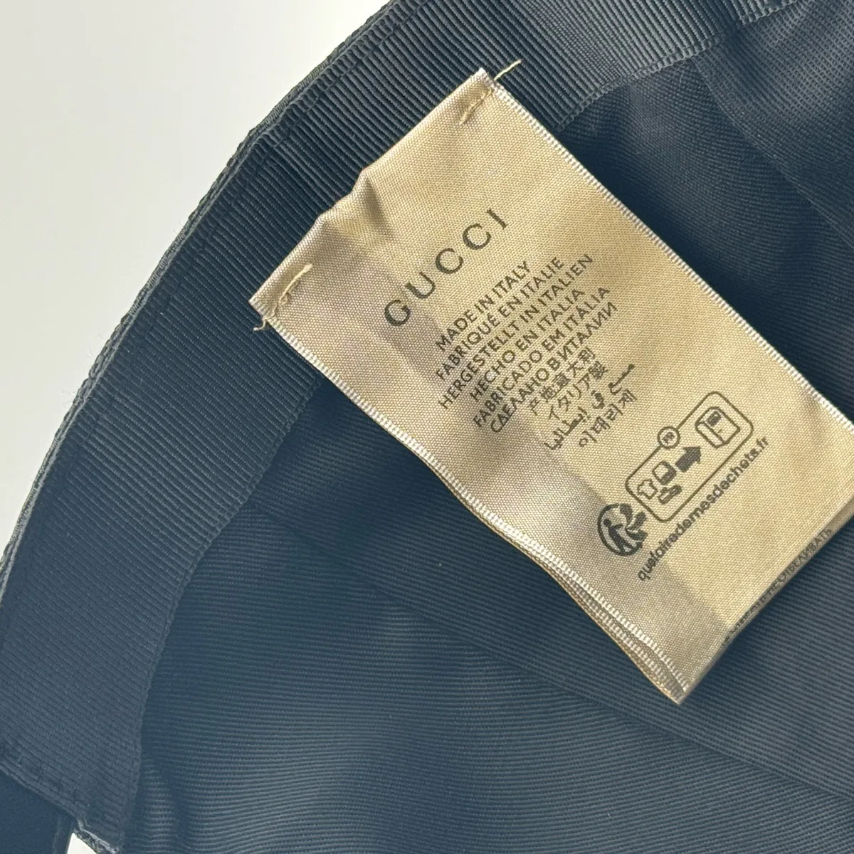 Black GG canvas cap, close-up of the interior care label