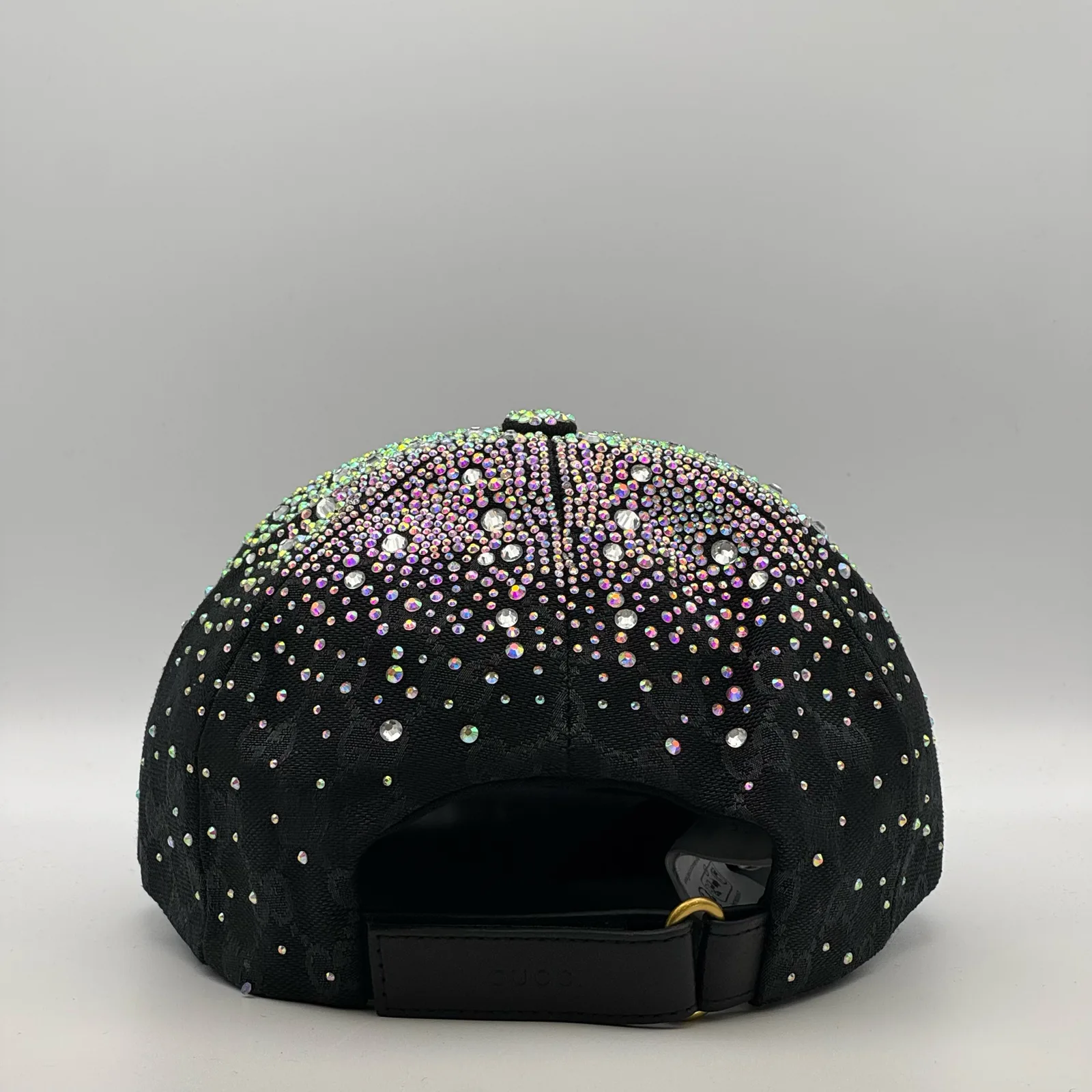Black crystal cap, back view with leather strap closure