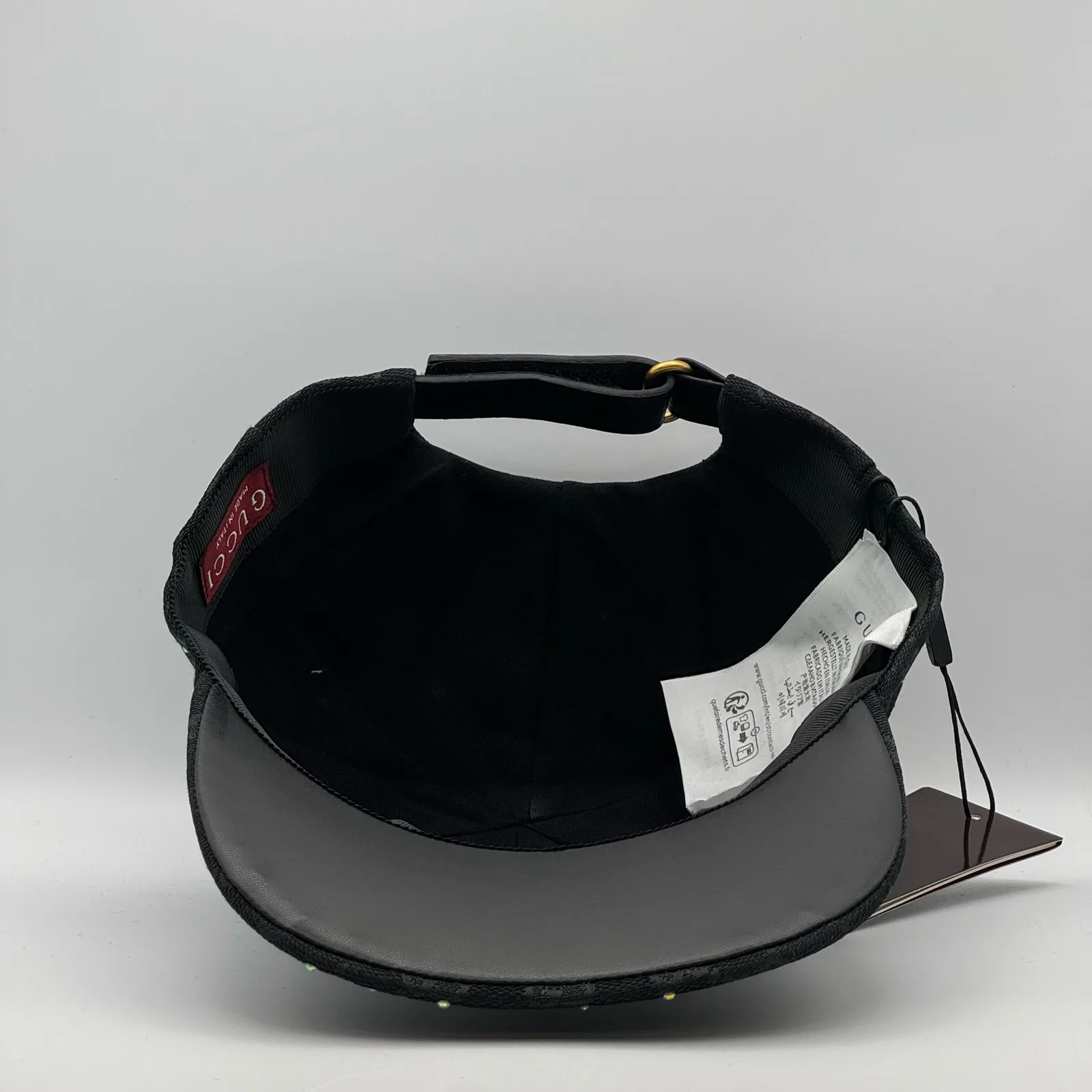 Black crystal cap interior, black lining with brand tag