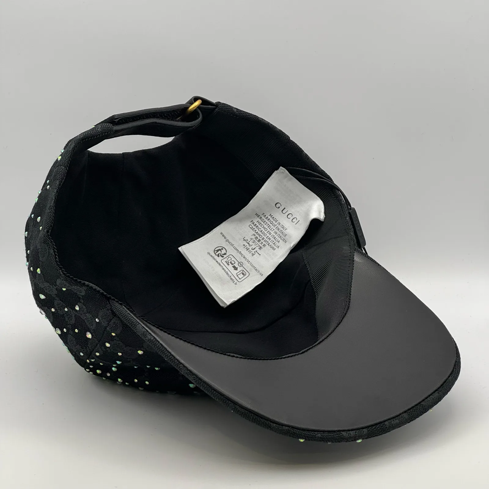Black crystal cap interior, care label and brand tag