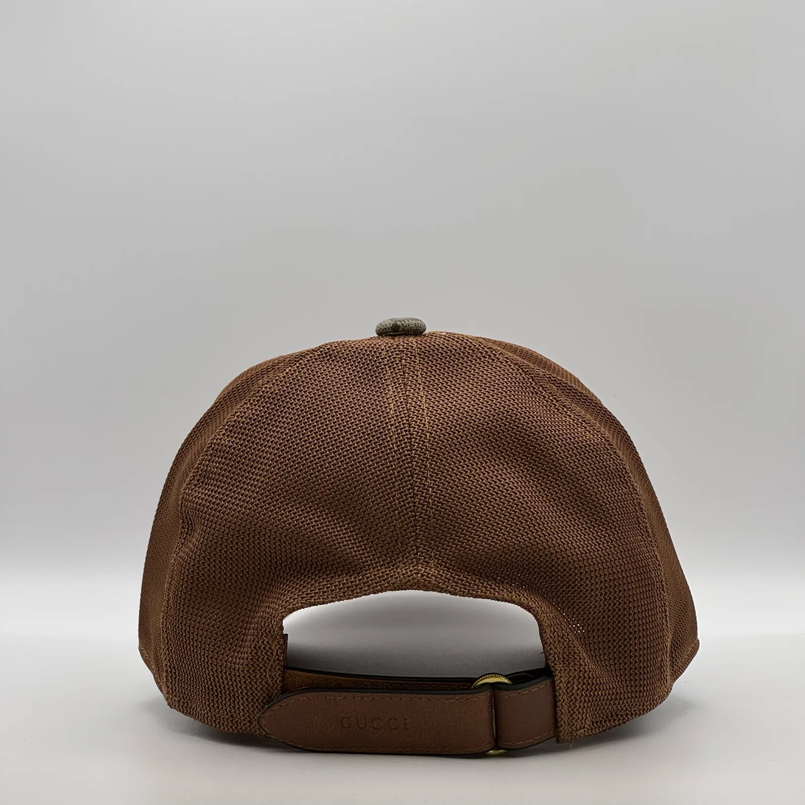 Brown GG trucker cap, back view showing mesh panel