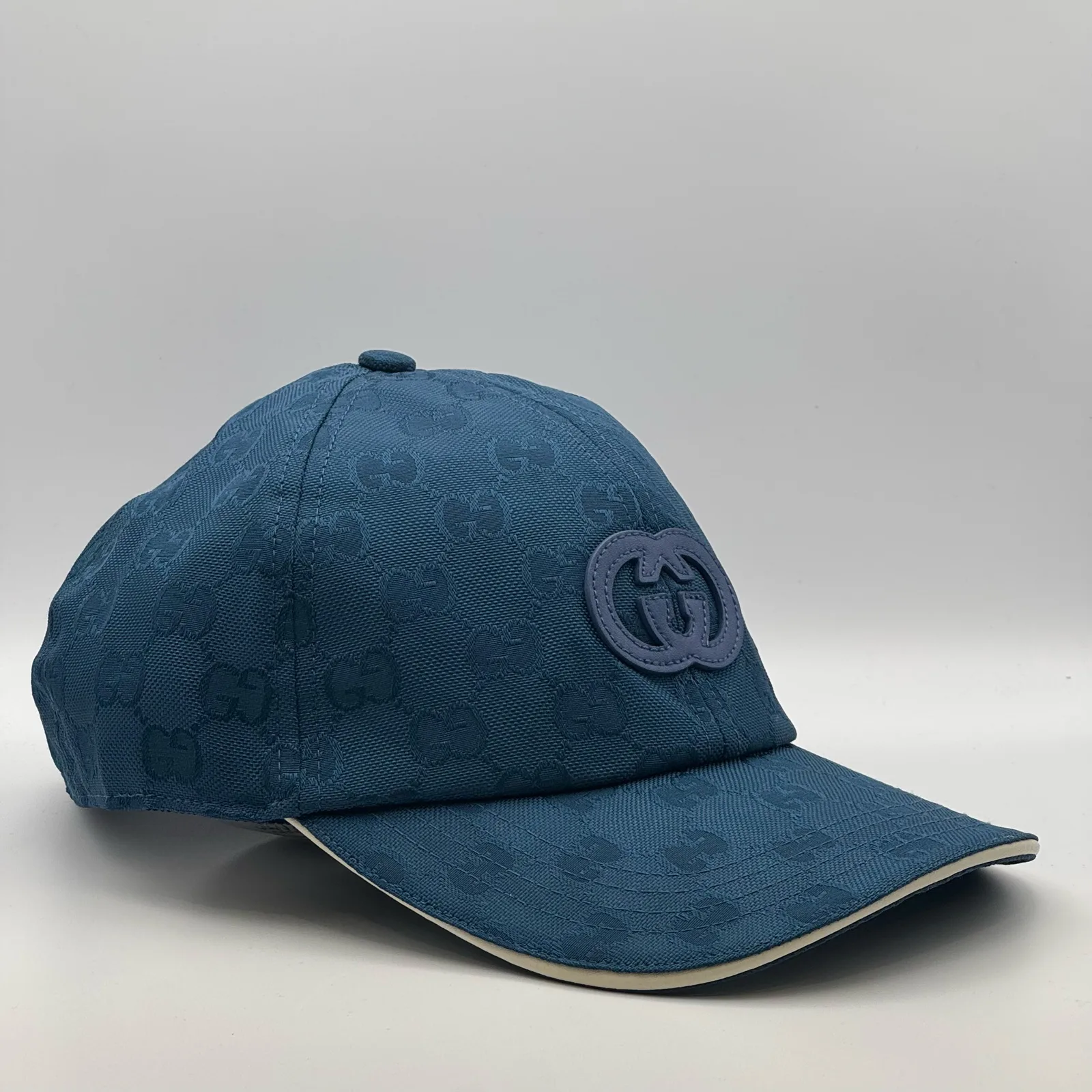 Blue interlocking G cap, three-quarter view showing logo patch