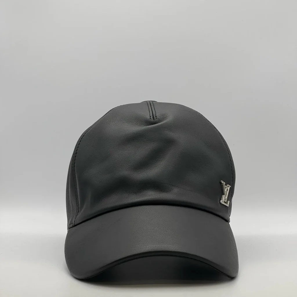 Black leather Louis Vuitton cap, three-quarter front view.
