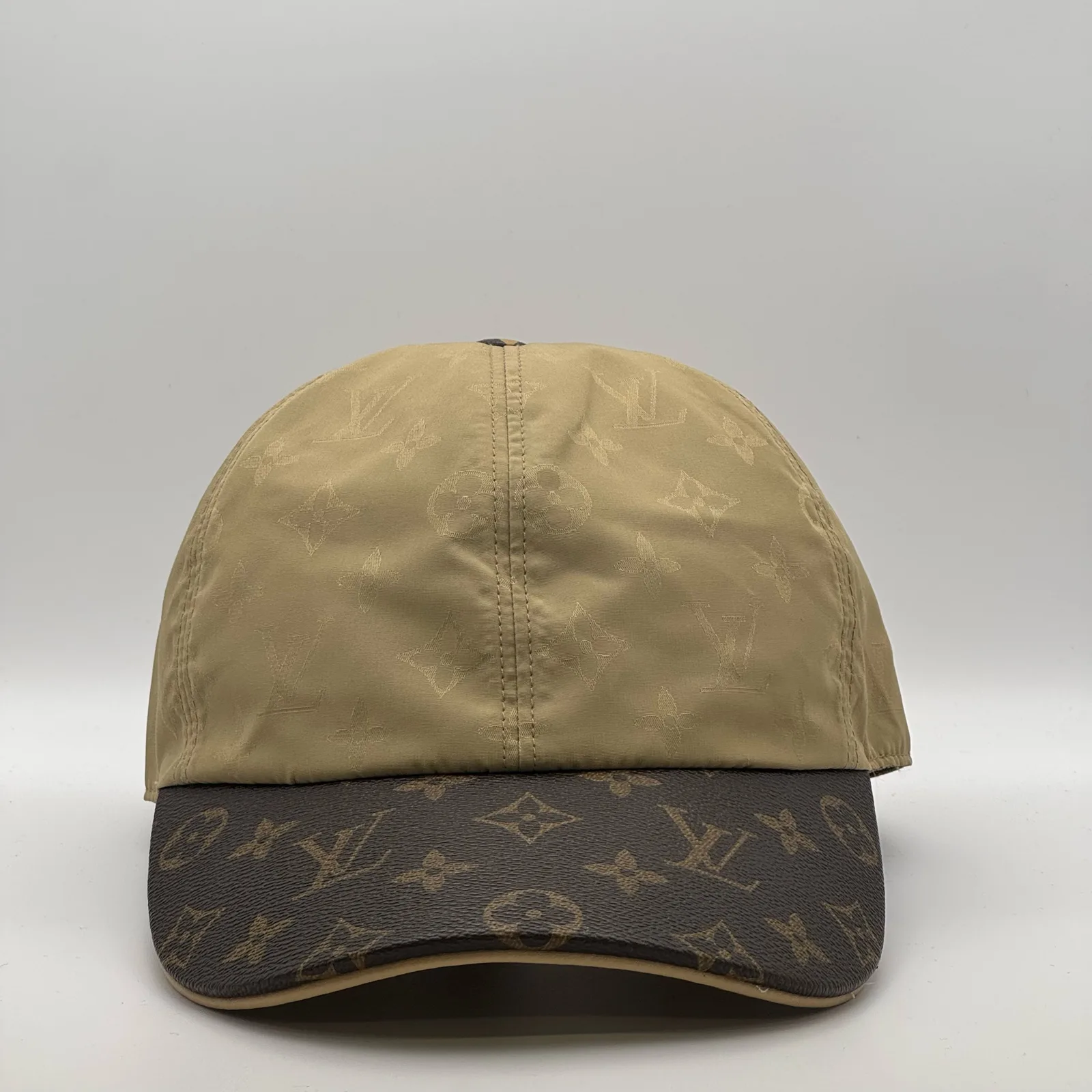 Beige monogram brim cap, front view.