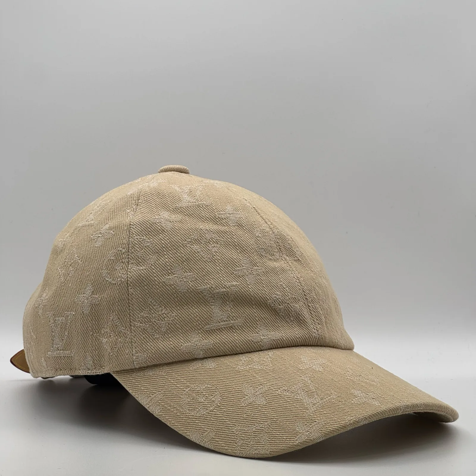 Beige monogram cap, three-quarter side view.