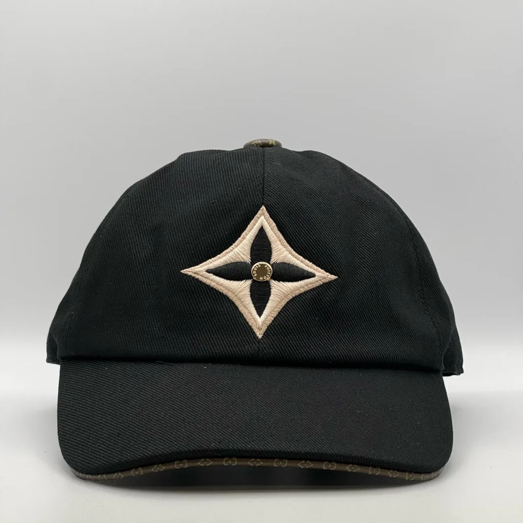 Black LV Monogram Flower cap, front view showing the flower emblem on the crown.
