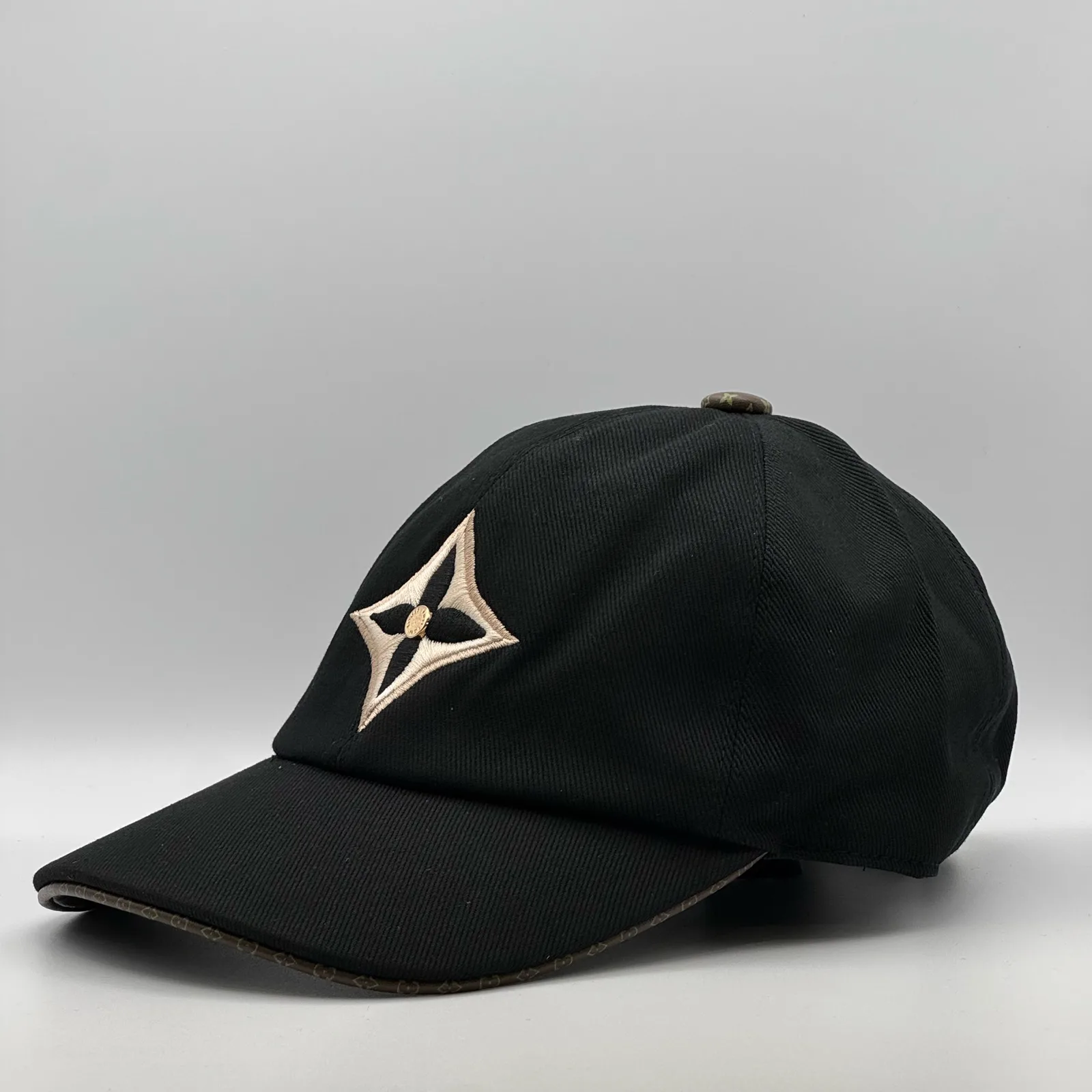 Black LV Monogram Flower cap, opposite side profile view.