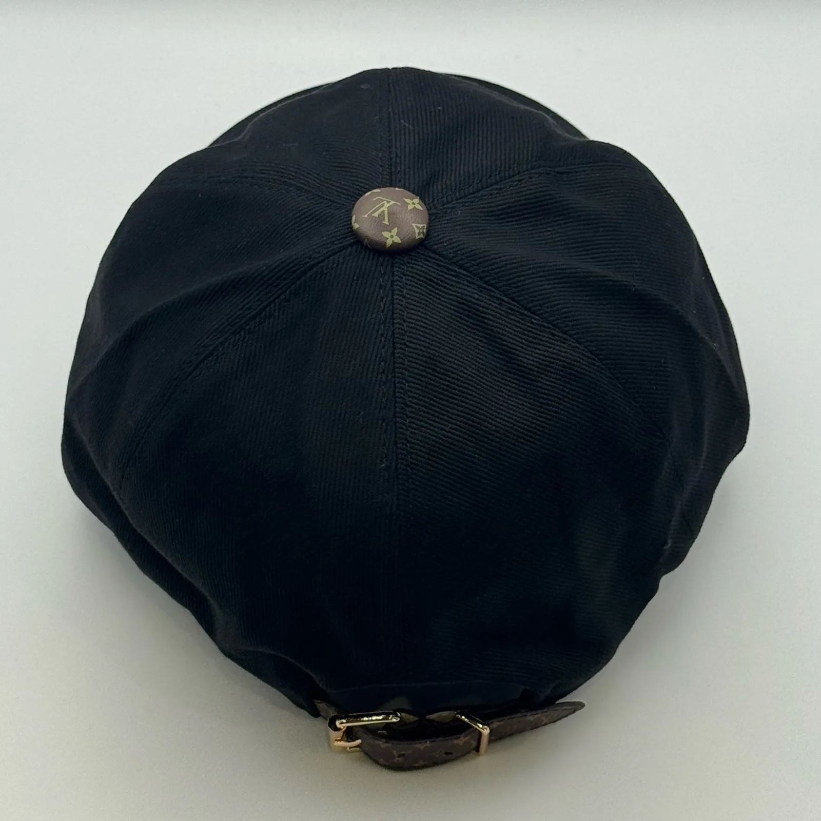 Black LV Monogram Flower cap, top-down view of the crown panels.