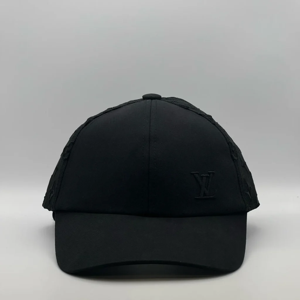 Black Louis Vuitton Monogram Mesh cap, front view showing the LV logo.